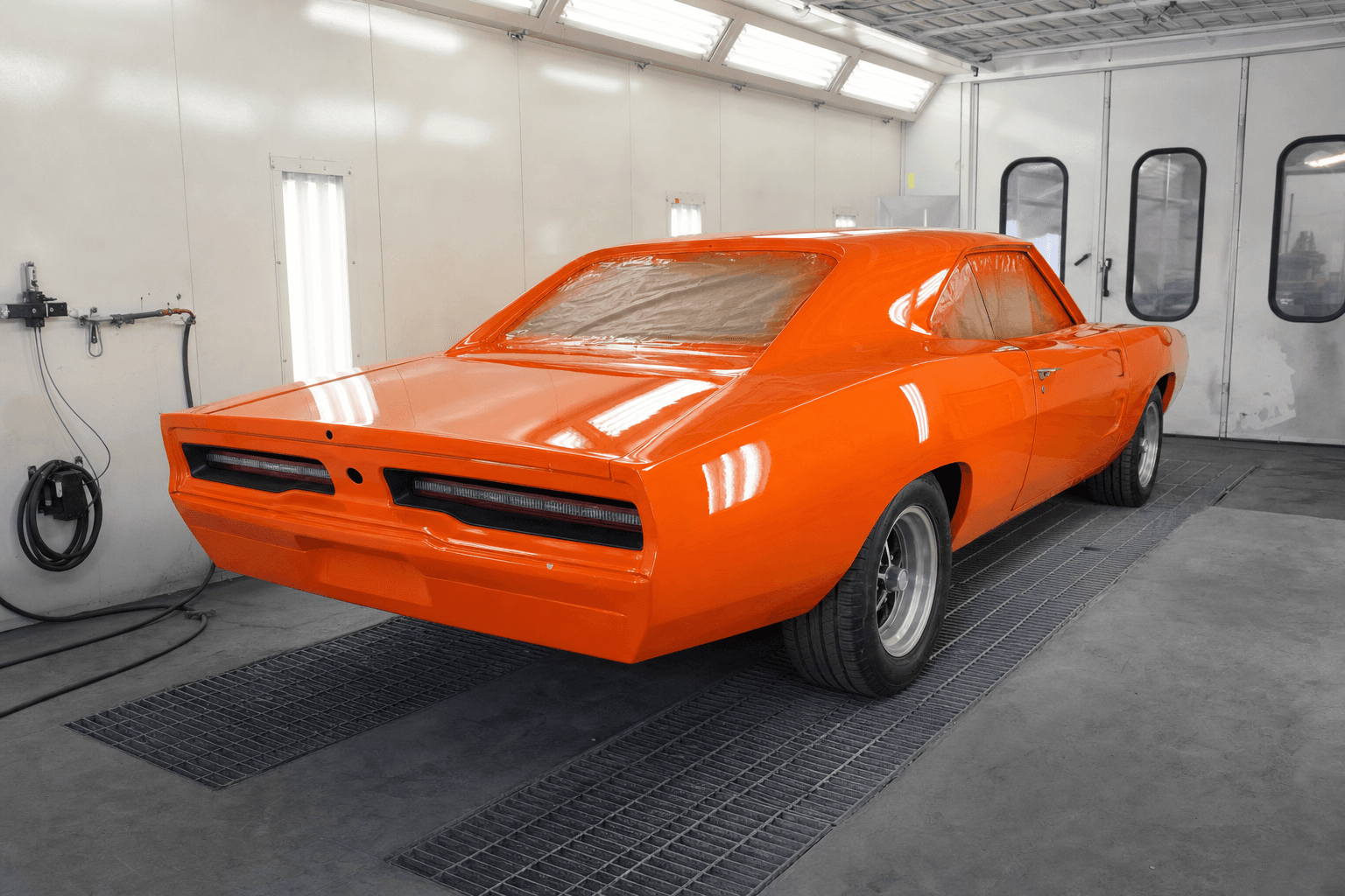 Classic muscle car in Jack's professional paint booth — custom color refinish in progress